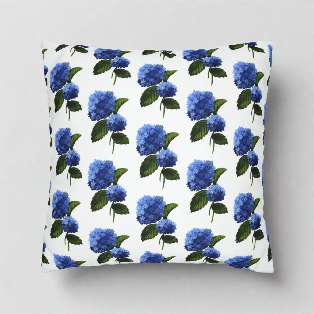 Photo of a throw pillow with a blue hydrangea patterned design