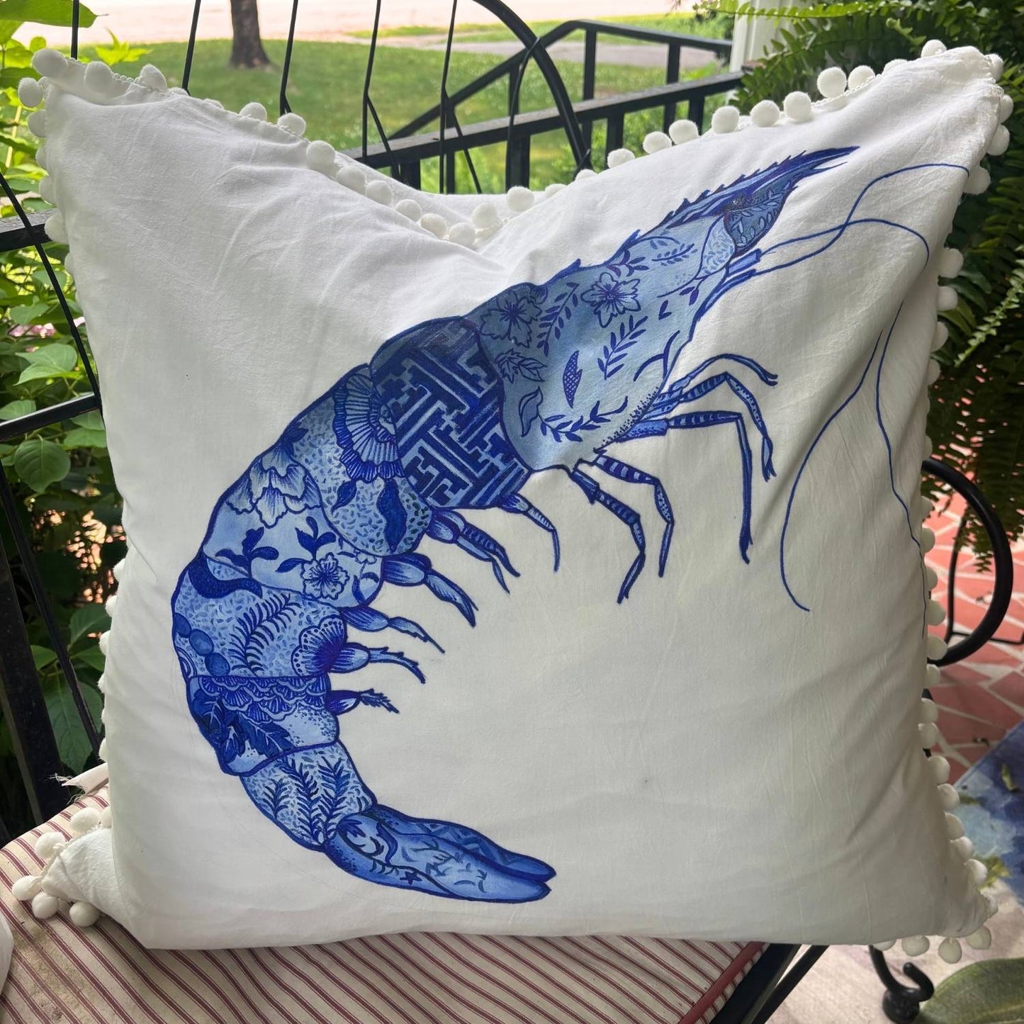 blue and white chinoiserie prawn hand-painted throw pillow with white pom pom trim
