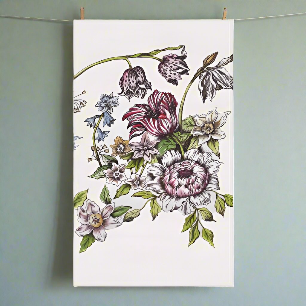 Photo of a white tea towel with botanical floral designs