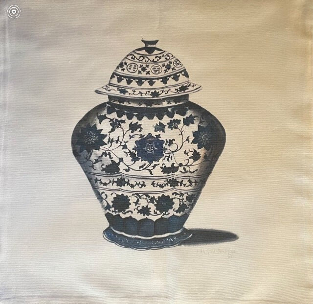 Photo of a square pillow cover with a blue chinoiserie floral vase design 