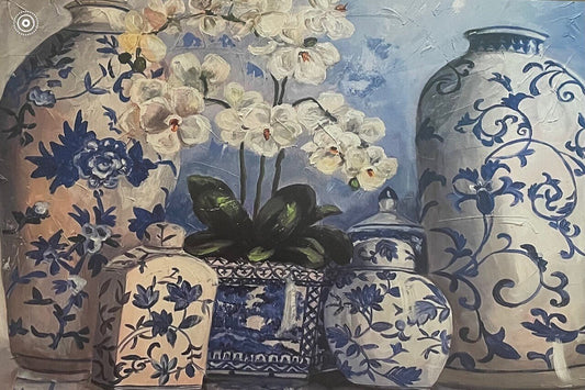 Close up photo of a paper placemat showcasing chinoiserie vases and white orchids