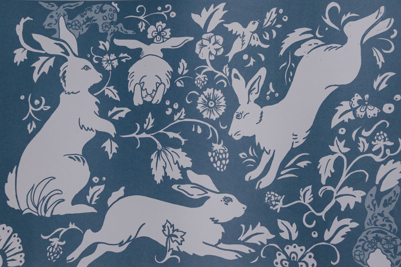 Photo of blue paper placemat with bunny artwork