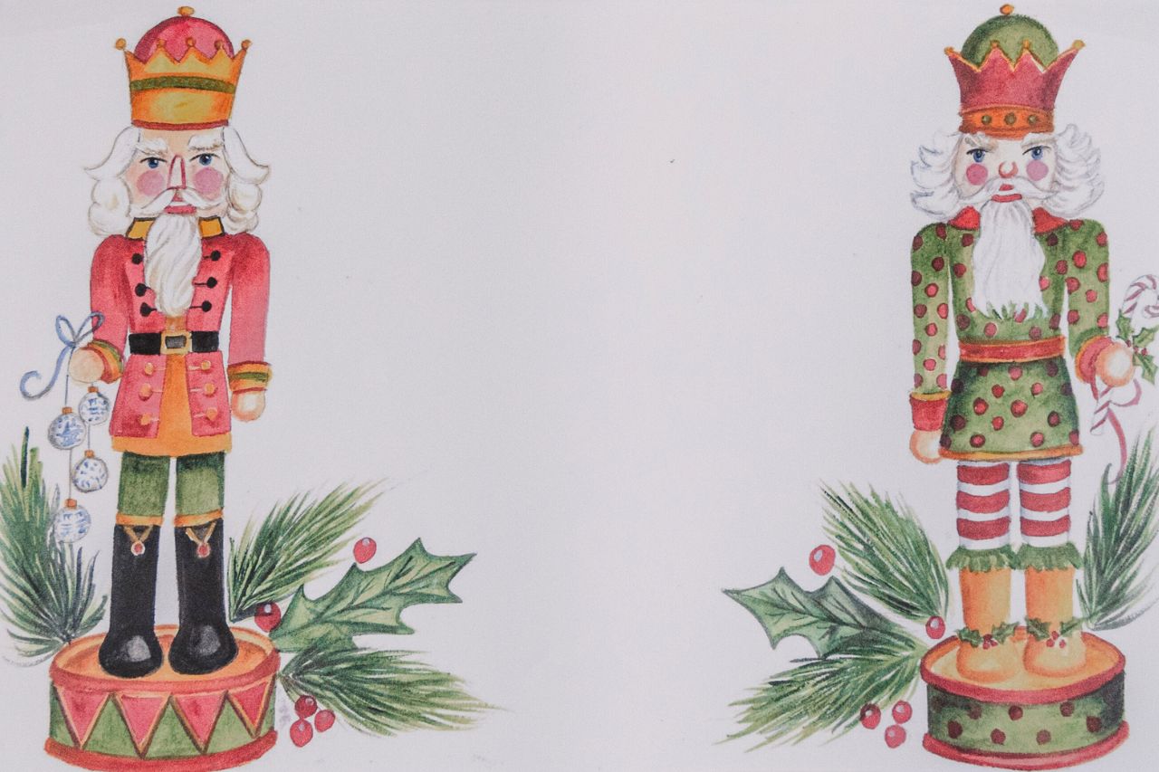 Up close photo of a paper placemat featuring two illustrated holiday nutcrackers