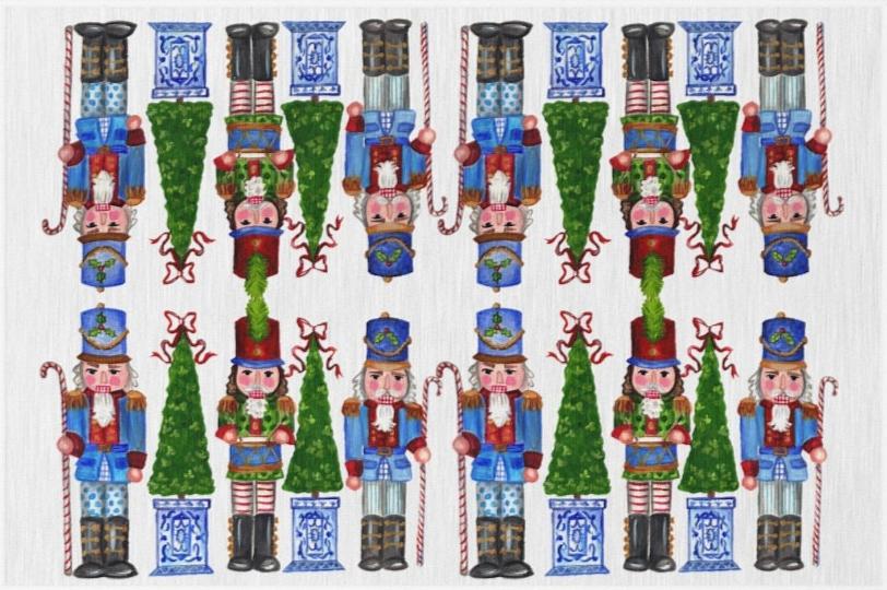 Photo of a whimsical holiday rug with a white background featuring nutcrackers holding candy cane staffs and Christmas trees with a chinoiserie base