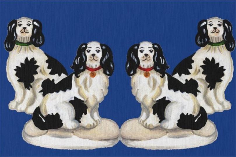 Image of a dark blue rug featuring four Staffordshire dog illustrations