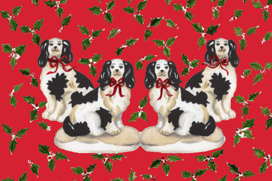 Photo of a red rug featuring four Staffordshire dogs with red bows surrounded by a holly pattern