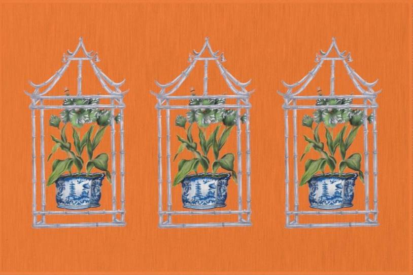 Photo of an orange rug with three pagodas. Each pagoda has a plant in a blue chinoiserie painted pot inside. 