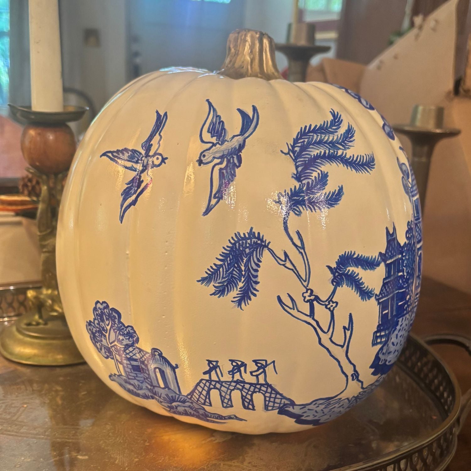 Back view of the Temple Garden pumpkin with hand-painted blue birds and botanical details.