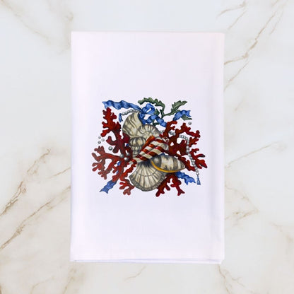 White Hill & Dale Home tea towel featuring Dale Barattini McLin artwork of red coral, seashells, pearls, and blue ribbon accents on a light marble background.