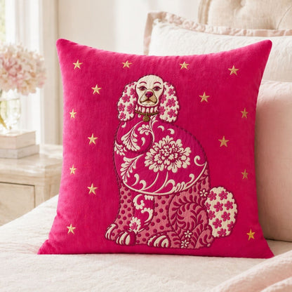 Bright pink Staffordshire Dog accent pillow with gold star details and a vintage-inspired floral dog illustration styled in a light, elegant bedroom.