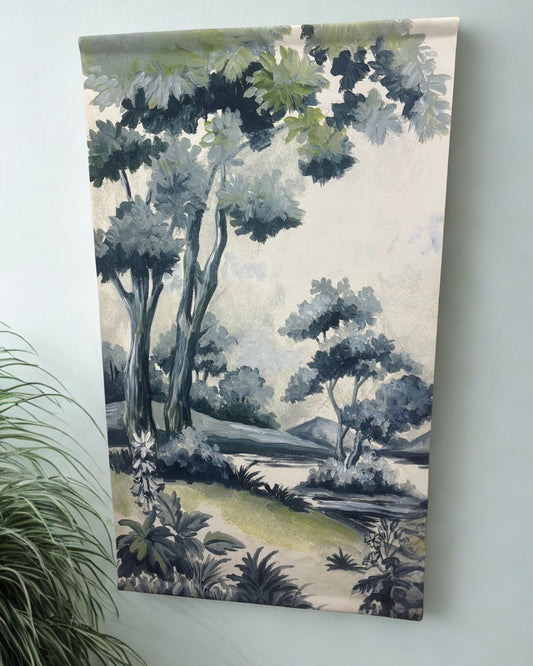 Canvas wall hanging depicting a painted grove scene with layered trees, soft foliage, and tranquil natural tones in green, blue, and ivory.