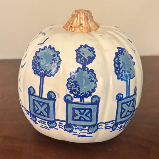 Hand-painted pumpkin featuring blue topiary planters in chinoiserie style with a gold stem