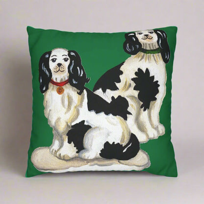 Photo of a canvas pillow featuring two Staffordshire dogs and a green background