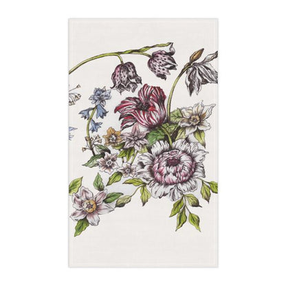 Photo of a white tea towel with botanical floral designs